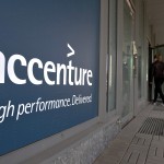 People enter an Accenture office in down